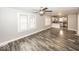 Open-concept layout with hardwood floors, seamlessly connecting the living room and kitchen at 4742 Primrose Ave, Indianapolis, IN 46205
