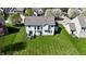 Aerial view showcasing the home's backyard, deck, and surrounding neighborhood at 5145 Greenheart Pl, Indianapolis, IN 46237