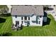 Aerial view highlighting the home's layout, backyard, deck, and lush surroundings at 5145 Greenheart Pl, Indianapolis, IN 46237