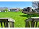 Expansive backyard view from the deck, highlighting the lush lawn and neighborhood setting at 5145 Greenheart Pl, Indianapolis, IN 46237