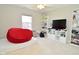 Spacious bedroom featuring a red beanbag chair, modern lighting, and a ceiling fan at 5145 Greenheart Pl, Indianapolis, IN 46237