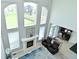 View from above, showing the fireplace, tall windows, and workspace off the living room at 5145 Greenheart Pl, Indianapolis, IN 46237