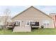 Spacious backyard with a well-kept lawn, a deck, and an area for outdoor seating and entertaining at 5301 Tanglewood Ln, Whitestown, IN 46075