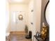 Inviting entryway with stylish decor, a bright white door, and wood-look flooring at 5301 Tanglewood Ln, Whitestown, IN 46075
