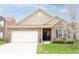 Charming brick home with a well-manicured lawn and attached two-car garage at 5301 Tanglewood Ln, Whitestown, IN 46075