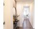 Bright hallway with modern decor and wood-look flooring leading to the living area at 5301 Tanglewood Ln, Whitestown, IN 46075