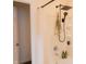 Modern shower with a rainfall showerhead, handheld sprayer, and built-in shelving at 5301 Tanglewood Ln, Whitestown, IN 46075