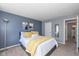 Relaxing bedroom featuring a comfortable queen bed with soft, neutral-toned bedding at 6018 Maple Forge Cir, Indianapolis, IN 46254