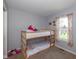 Bedroom featuring bunk beds and colorful curtains at 6018 Maple Forge Cir, Indianapolis, IN 46254