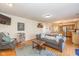 Comfortable living room features a fireplace, hardwood floors, and an open concept to the kitchen at 6018 Maple Forge Cir, Indianapolis, IN 46254