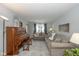 Inviting living room with stylish decor, a decorative piano, and an open floor plan at 6018 Maple Forge Cir, Indianapolis, IN 46254