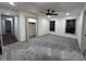 Large bedroom with plush carpet, recessed lighting, and two windows at 609 W Pearl St, Trafalgar, IN 46181