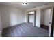 Bright bedroom features plush carpeting, closet, and neutral walls, creating a serene atmosphere at 609 W Pearl St, Trafalgar, IN 46181