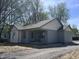 Charming single-story home with light blue siding and a well-maintained gravel driveway at 609 W Pearl St, Trafalgar, IN 46181