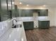 Modern kitchen with stainless steel appliances, stylish backsplash, and sleek cabinetry at 609 W Pearl St, Trafalgar, IN 46181