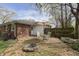 Cozy backyard with a brick patio, fire pit, and outdoor dining area perfect for entertaining at 7026 Spring Mill Rd, Indianapolis, IN 46260