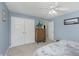 Serene blue bedroom with plenty of storage space in the large closets at 7026 Spring Mill Rd, Indianapolis, IN 46260