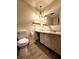 Retro bathroom with vintage fixtures, ample counter space, and a neutral color scheme at 7132 N Stafford Ln, Martinsville, IN 46151