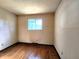Bright bedroom featuring wood floors, a window and neutral walls at 7132 N Stafford Ln, Martinsville, IN 46151