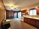 Open living space with a brick fireplace and adjacent kitchen, perfect for Gathering gatherings at 7132 N Stafford Ln, Martinsville, IN 46151
