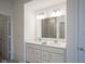 Bright bathroom with double vanity, large mirror, and walk-in shower at 714 Faudree Dr, Westfield, IN 46074