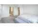 Clean, neutral bedroom with pull out bed, gray carpet, and walk-in closet access at 714 Faudree Dr, Westfield, IN 46074