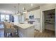 Bright kitchen with island, white cabinetry, pantry and stainless steel appliances at 714 Faudree Dr, Westfield, IN 46074