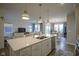 Open concept kitchen with island, stainless steel dishwasher, and eat-in breakfast nook at 714 Faudree Dr, Westfield, IN 46074