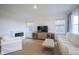 Inviting living room features a fireplace, media center, and comfortable white furniture at 714 Faudree Dr, Westfield, IN 46074