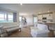 Open-concept living area showcasing a white sofa, a kitchen, and a dining table at 714 Faudree Dr, Westfield, IN 46074