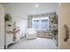 Bright sitting room featuring a bookshelf wallpaper accent wall and stylish decor at 714 Faudree Dr, Westfield, IN 46074