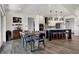 Open dining area with modern table and chairs next to the kitchen at 725 Meadowbrook Ln, Franklin, IN 46131