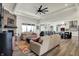 Bright living room featuring an open floor plan, stone fireplace, and modern decor at 725 Meadowbrook Ln, Franklin, IN 46131