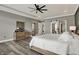 Bright main bedroom featuring a tray ceiling, modern furniture, and great natural light at 725 Meadowbrook Ln, Franklin, IN 46131