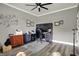 Office featuring a modern desk setup, wood floors, ceiling fan, and neutral walls at 725 Meadowbrook Ln, Franklin, IN 46131