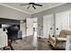 Bright office space with open doorway, hardwood floors, comfortable seating and natural light from a bright window at 725 Meadowbrook Ln, Franklin, IN 46131