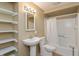 Bathroom features a pedestal sink and bathtub at 7260 Marla Dr, Indianapolis, IN 46256