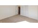 Bedroom with door to another room and closet doors at 7260 Marla Dr, Indianapolis, IN 46256