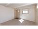 Bright living room featuring neutral colors, carpet, and ample natural light from a window at 7260 Marla Dr, Indianapolis, IN 46256