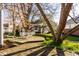 Charming backyard featuring a brick patio, lush greenery, and a seating area at 8037 Lynch Ln, Indianapolis, IN 46250