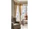 Relaxing armchair sits by window, natural light illuminating the refined interior at 8037 Lynch Ln, Indianapolis, IN 46250