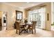 Formal dining room with neutral walls and carpet, plus a large window with natural light at 8037 Lynch Ln, Indianapolis, IN 46250