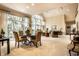 Elegant dining area with large windows, comfortable seating, and direct views to the living room at 8037 Lynch Ln, Indianapolis, IN 46250