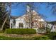 Charming white home with a manicured lawn and lovely landscaping at 8037 Lynch Ln, Indianapolis, IN 46250