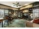 Spacious living room with built-in bookshelves, fireplace, neutral walls, and carpet at 8037 Lynch Ln, Indianapolis, IN 46250