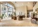 Open-concept living room featuring soaring windows, neutral tones, and comfortable seating, blending style and comfort at 8037 Lynch Ln, Indianapolis, IN 46250