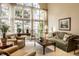 Cozy living room with large windows, comfortable seating, hardwood accents, and stylish decor at 8037 Lynch Ln, Indianapolis, IN 46250