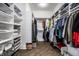 Spacious walk-in closet featuring custom shelving and rods for optimal organization and storage at 8037 Lynch Ln, Indianapolis, IN 46250