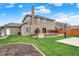 Well-maintained backyard features a shed, basketball court, and deck, offering plenty of space for outdoor enjoyment at 8734 Blue Marlin Dr, Indianapolis, IN 46239