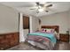 Bedroom with a wooden headboard, a ceiling fan and abundant natural light at 8734 Blue Marlin Dr, Indianapolis, IN 46239